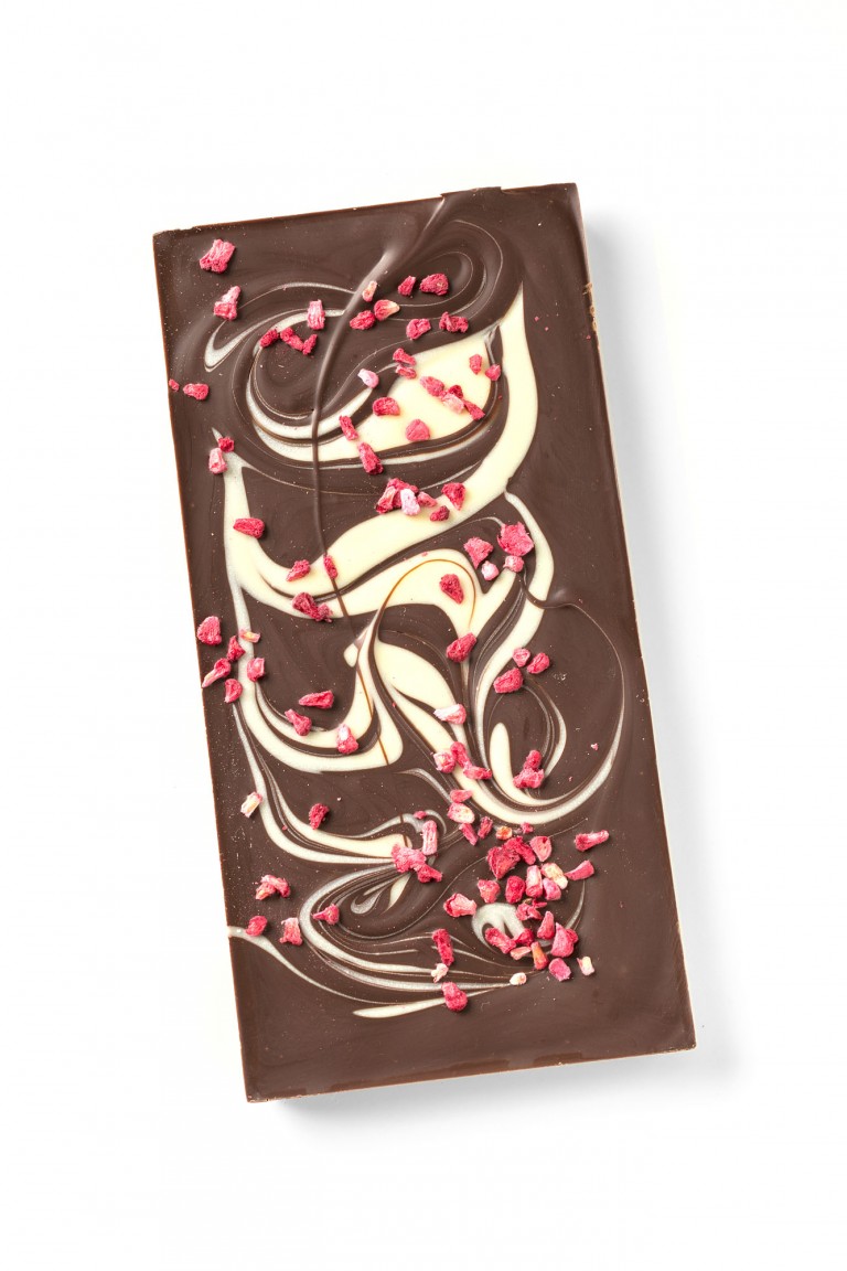 dark chocolate bar with a white chocolate swirl and raspberry crumbs