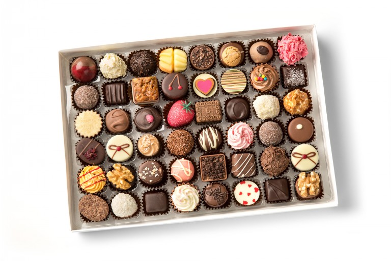 containing a selection of creams, truffles and pralines