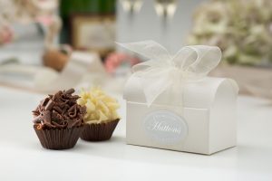 two choclates in a white chest box and white organza